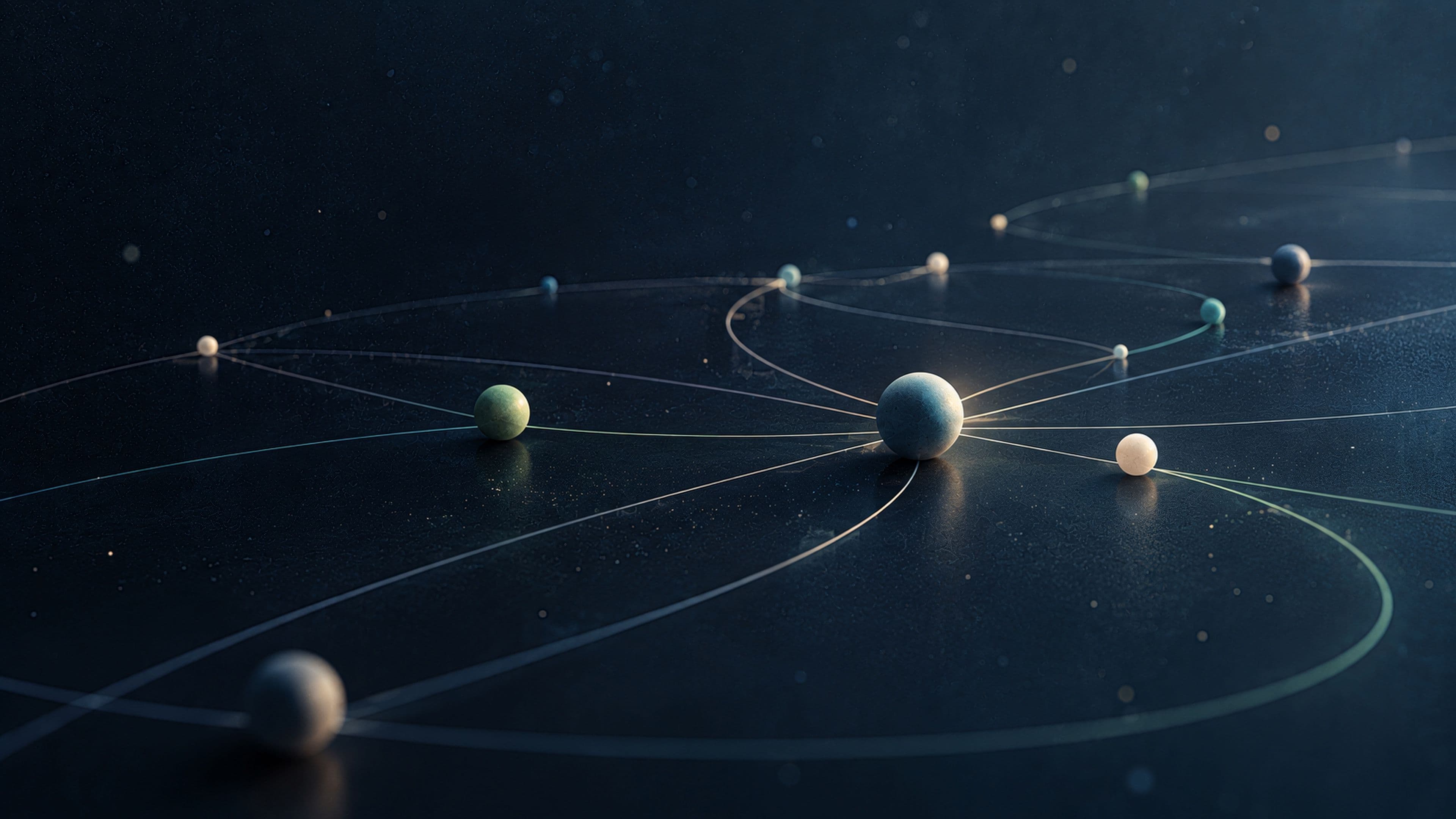 Matte spheres rest on a dark navy surface, linked by thin glowing orbital lines