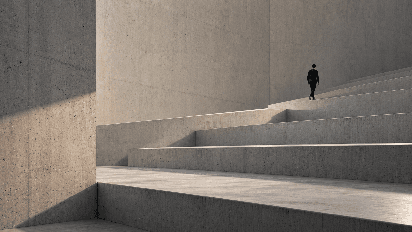 A person ascending broad concrete steps.